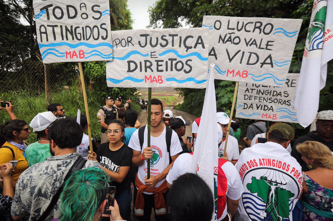 MAB holds signs that say, “We are all affected,” “For Justice and Rights” and “Profit is not Worth More than Life” on January 25, 2020, in Córrego de Feijão, Brumadinho, Minas Gerais, Brazil.