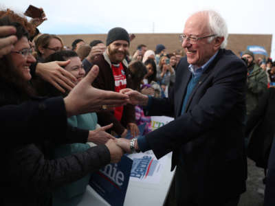 Bernie Sanders shakes hands with supporters