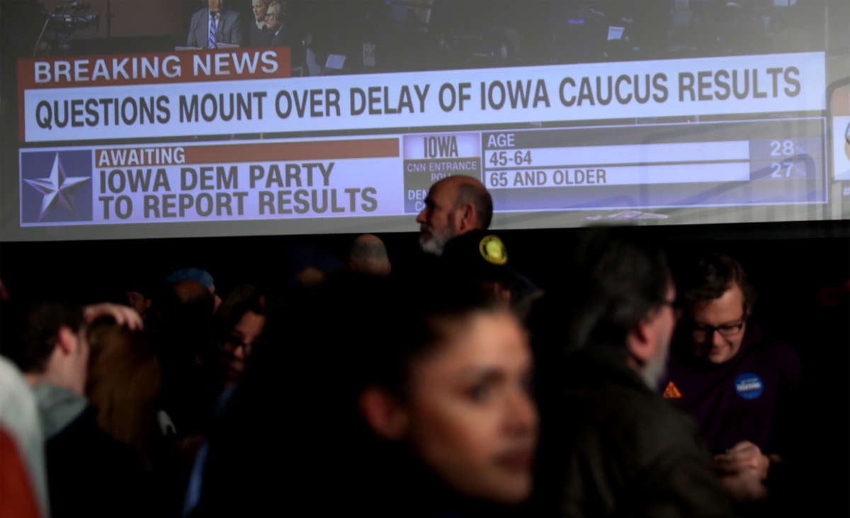 Supporters of Democratic presidential candidate Sen. Bernie Sanders wait for results to come in at his caucus night watch party on February 3, 2020, in Des Moines, Iowa.