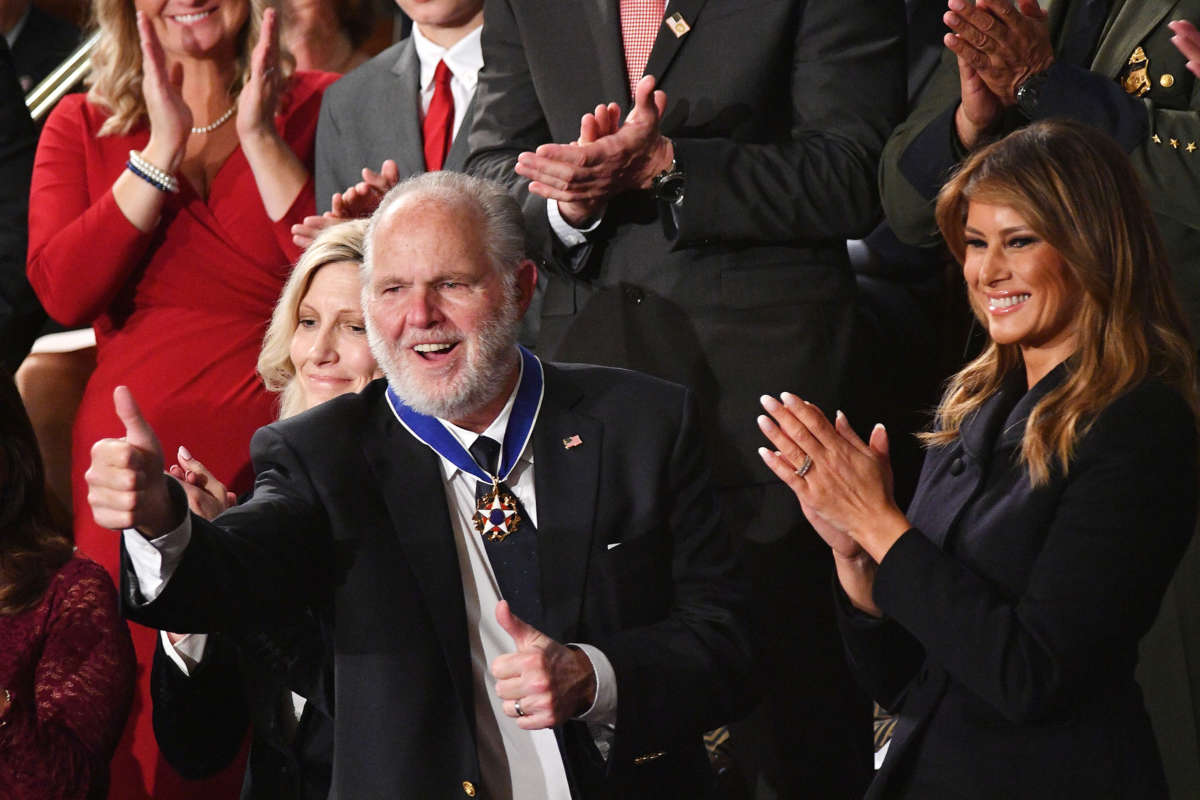 Rush Limbaugh gives a thumbs up while standing next to melania trump