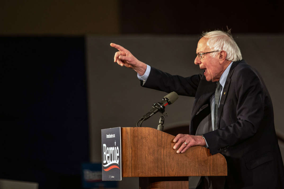 Sen. Bernie Sanders speaks to supporters as they wait for results to come in at his caucus night watch party on February 3, 2020, in Des Moines, Iowa.