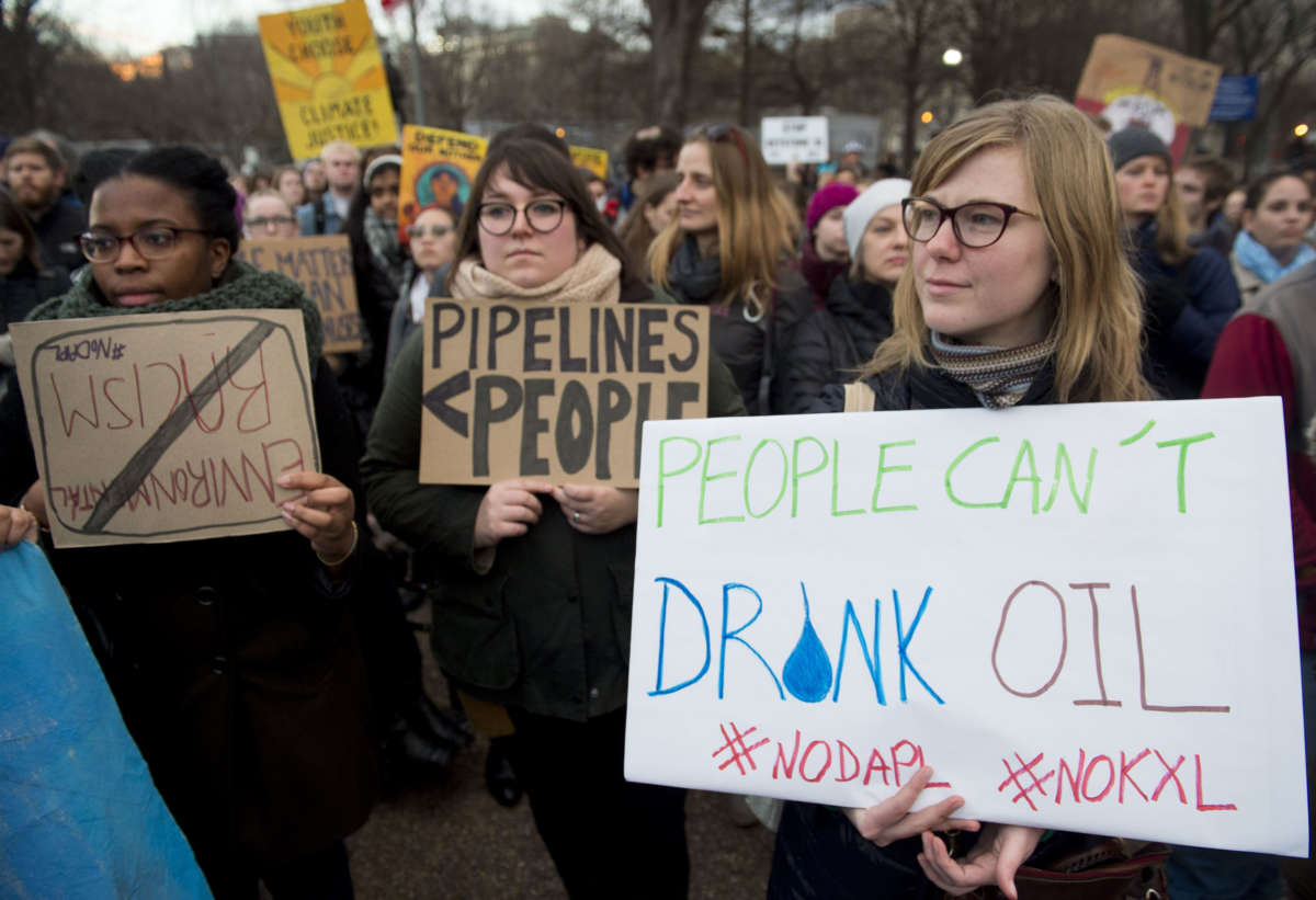 Opponents of the Keystone XL and Dakota Access pipelines hold a rally at Lafayette Park next to the White House in Washington, D.C., on January 24, 2017.