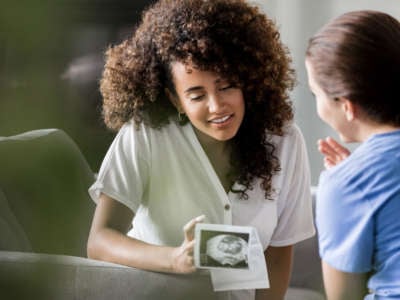 Woman with ultrasound consults with nurse