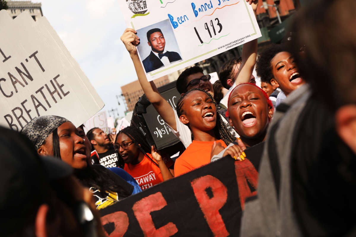 People participate in a protest to mark the five-year anniversary of the death of Eric Garner in a confrontation with a police officer in the borough of Staten Island, July 17, 2019, New York City.