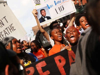 People participate in a protest to mark the five-year anniversary of the death of Eric Garner in a confrontation with a police officer in the borough of Staten Island, July 17, 2019, New York City.