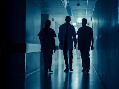 Doctor and nurses in hospital hallway