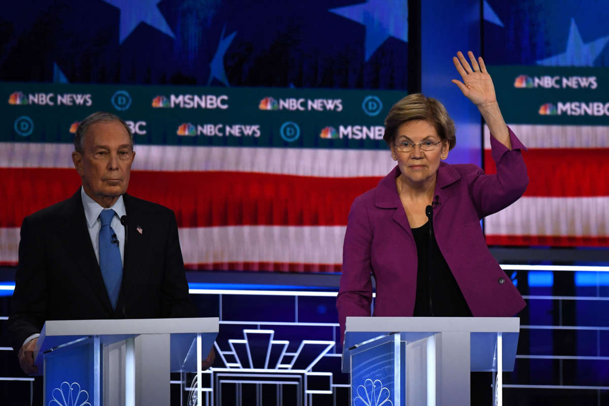 Sen. Elizabeth Warren gestures next to former New York Mayor Mike Bloomberg during the ninth Democratic primary debate of the 2020 presidential campaign season at the Paris Theater in Las Vegas, Nevada, on February 19, 2020.