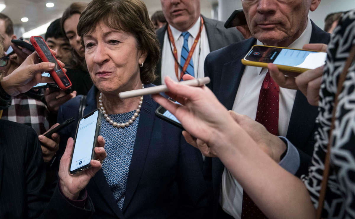 Sen. Susan Collins walks from the Senate subway to the Senate chamber to cast a vote in the Senate impeachment trial of President Trump on February 5, 2020, in Washington, D.C.