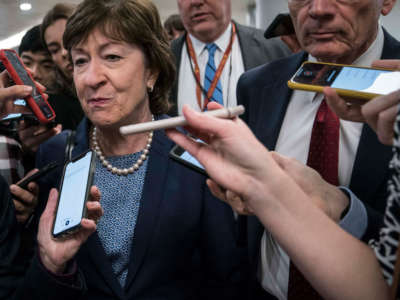 Sen. Susan Collins walks from the Senate subway to the Senate chamber to cast a vote in the Senate impeachment trial of President Trump on February 5, 2020, in Washington, D.C.