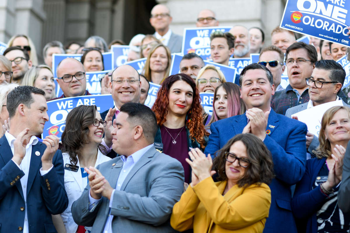 Colorado legislator Brianna Titone, at center in purple shirt, is a transgender woman who defeated her Republican opponent in a conservative district during the 2018 general election, to become Colorado’s first out transgender state lawmaker -- one of only four in the country.