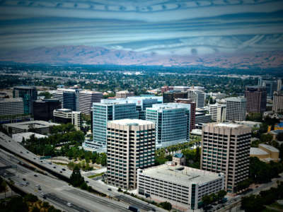 San Jose, California, with dollar bills overlaid against the sky