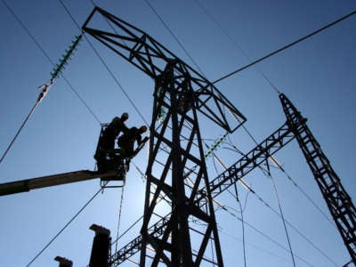 People work at repairing power lines