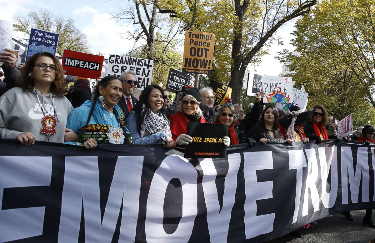 Activists take part in the "Fire Drill Friday" climate change protest on November 8, 2019, in Washington, D.C.