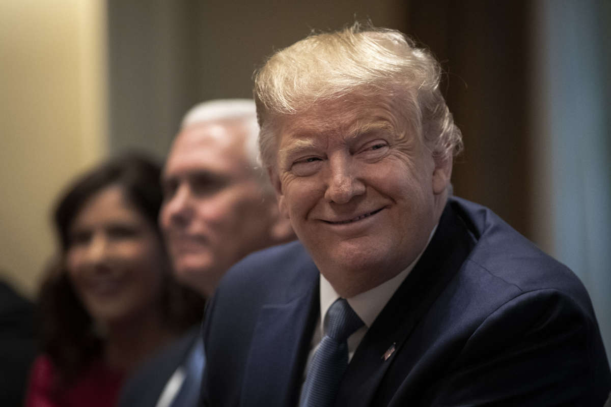 Donald Trump listens during a meeting about the Governors Initiative on Regulatory Innovation in the Cabinet Room of the White House on December 16, 2019, in Washington, D.C.
