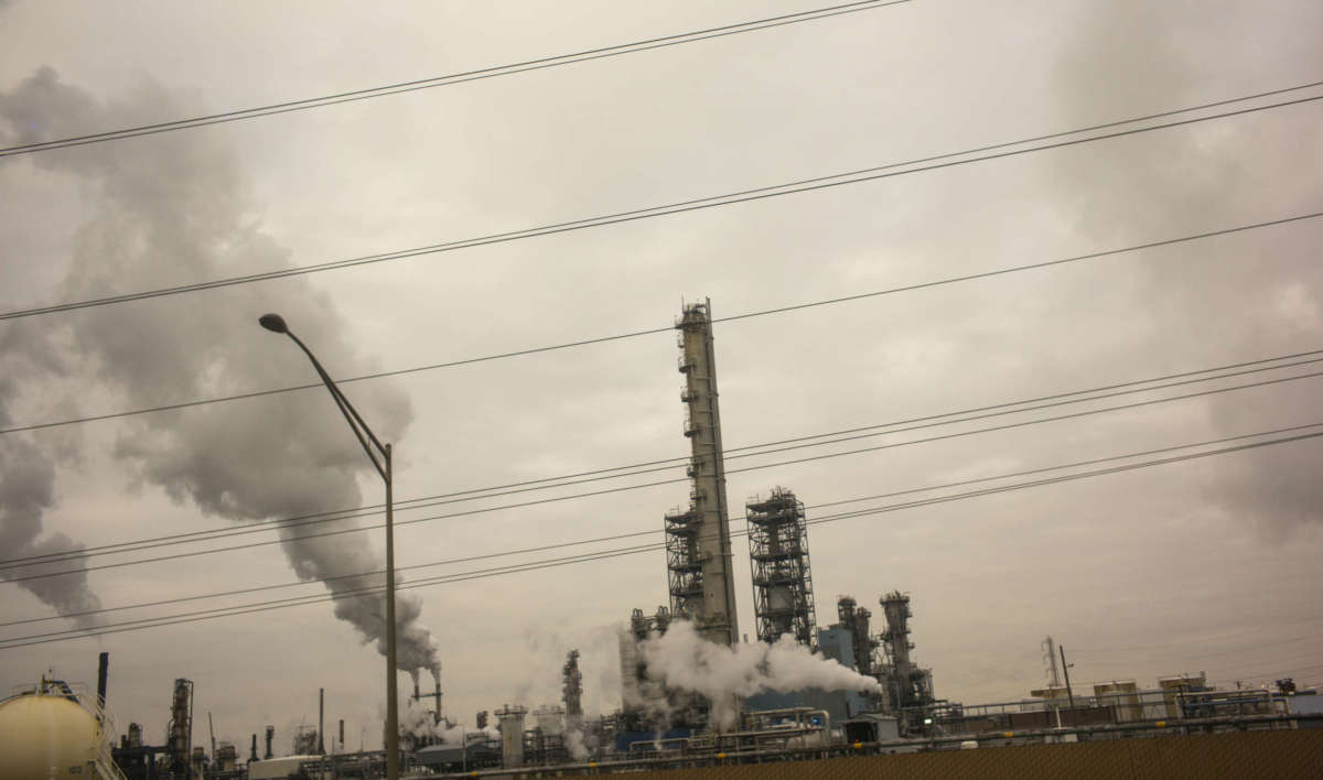 Smoke pours out of towers of the Phillips 66 Bayway oil refinery along the New Jersey Turnpike in Linden, New Jersey, December 11, 2019.