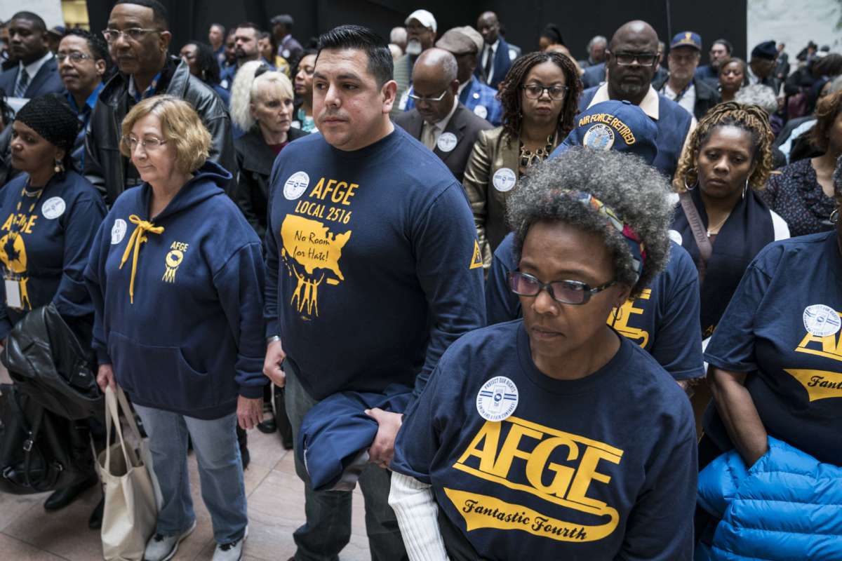 Members and supporters of the American Federation of Government Employees (AFGE) participate in a "Stand Up, Stand In protest in the Hart Senate Office Building Atrium as part of the 2020 Legislative and Grassroots Mobilization Conference on February 11, 2020, in Washington, D.C.