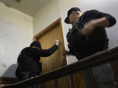 U.S. Immigration and Customs Enforcement (ICE), officers stage a raid to arrest an undocumented immigrant in the Bushwick neighborhood of Brooklyn on April 11, 2018, in New York City.