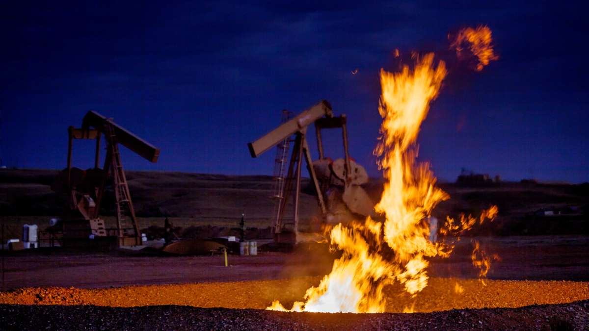 Flames from a flaring pit near a well in the Bakken Oil Field.