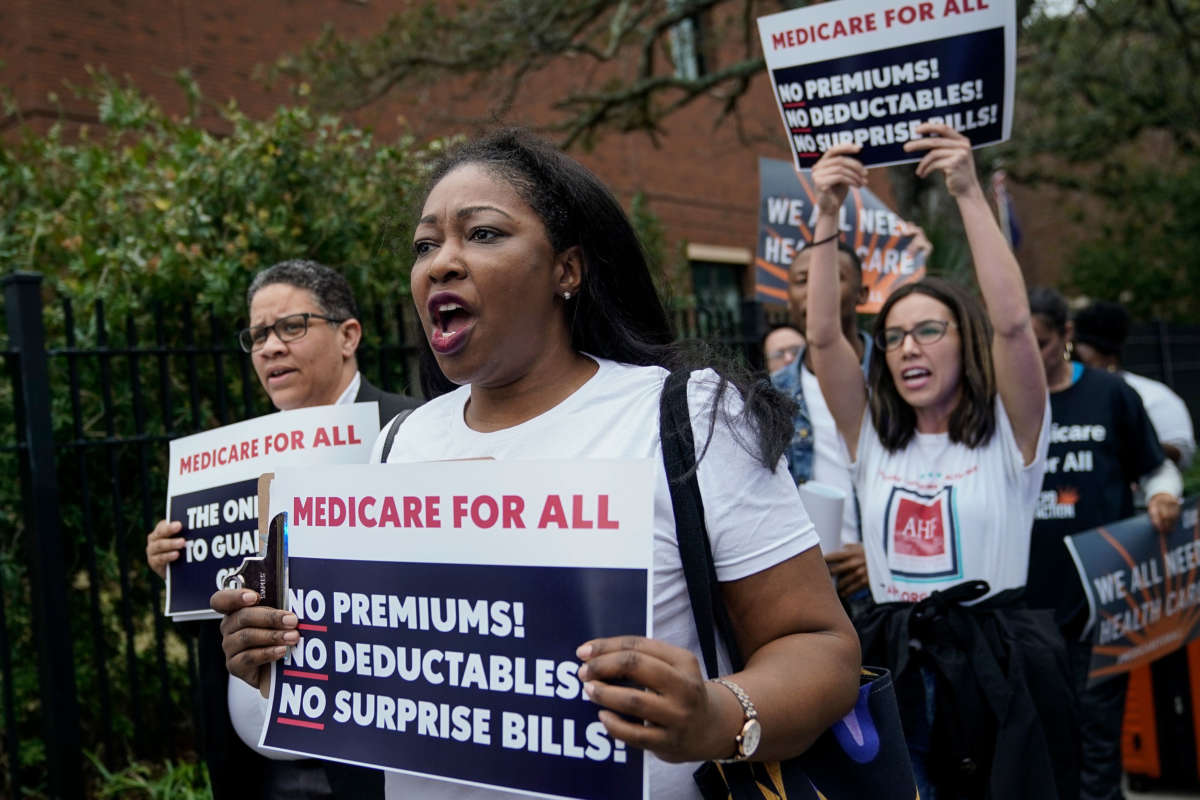 Supporters of "Medicare For All" demonstrate outside of the Charleston Gaillard Center ahead of the Democratic presidential debate on February 25, 2020, in Charleston, South Carolina.