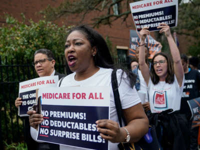 Supporters of "Medicare For All" demonstrate outside of the Charleston Gaillard Center ahead of the Democratic presidential debate on February 25, 2020, in Charleston, South Carolina.