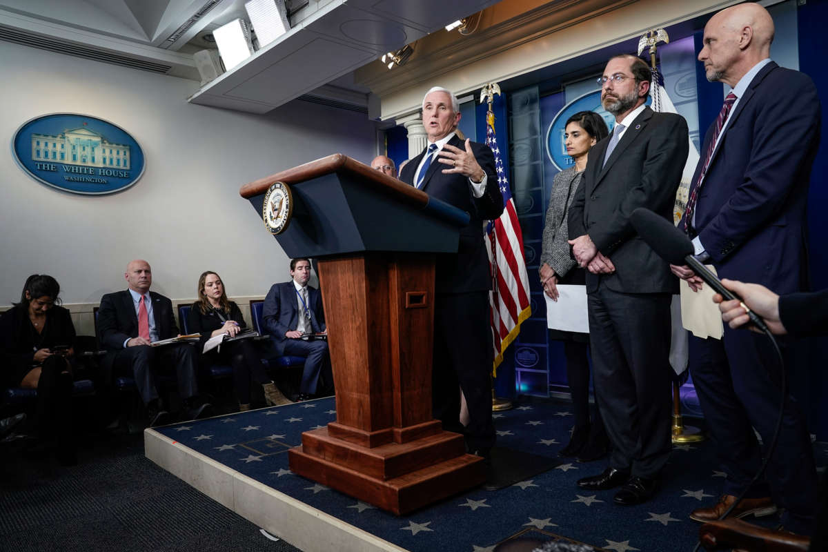 Mike Pence speaks into a microphone at a podium