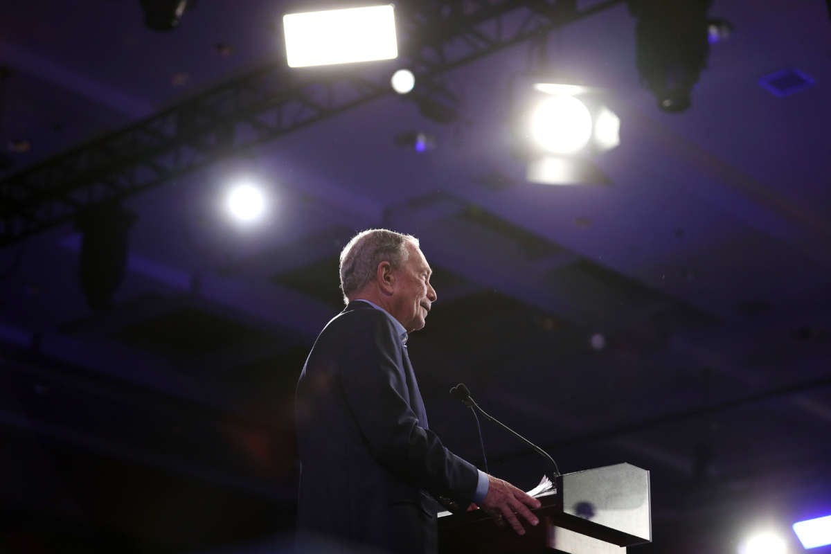 Michael Bloomberg speaks at a podium