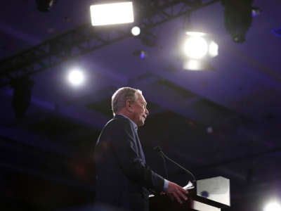 Michael Bloomberg speaks at a podium