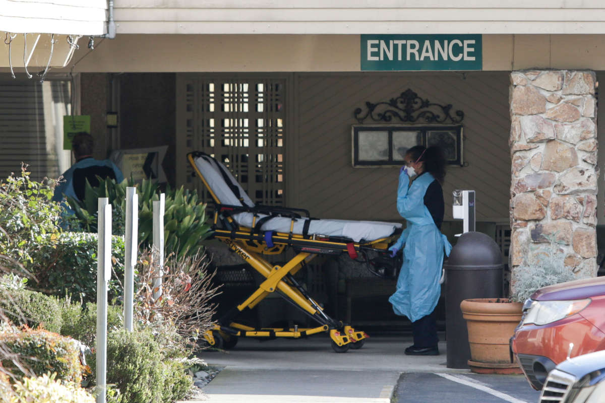 A stretcher is moved from an AMR ambulance to the Life Care Center of Kirkland, Washington on February 29, 2020. The emergence of coronavirus disease at the skilled nursing facility has left two people hospitalized and dozens more with suspicious symptoms.