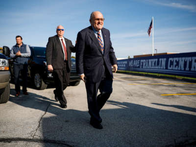 Former New York City Mayor Rudy Giuliani arrives to campaign in Franklin Township, Indiana, on November 3, 2018.