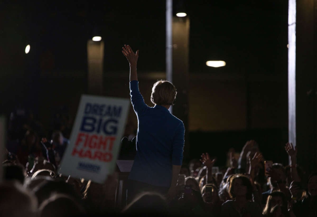 Sen. Elizabeth Warren waves during a rally on March 3, 2020, in Detroit, Michigan, at the Detroit Kitchen Connect on Super Tuesday.