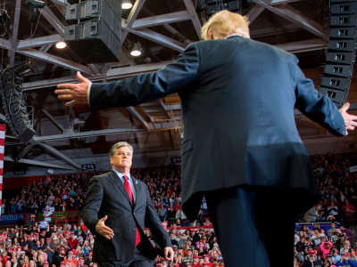 President Trump greets talk show host Sean Hannity at a Make America Great Again rally in Cape Girardeau, Missouri, on November 5, 2018.