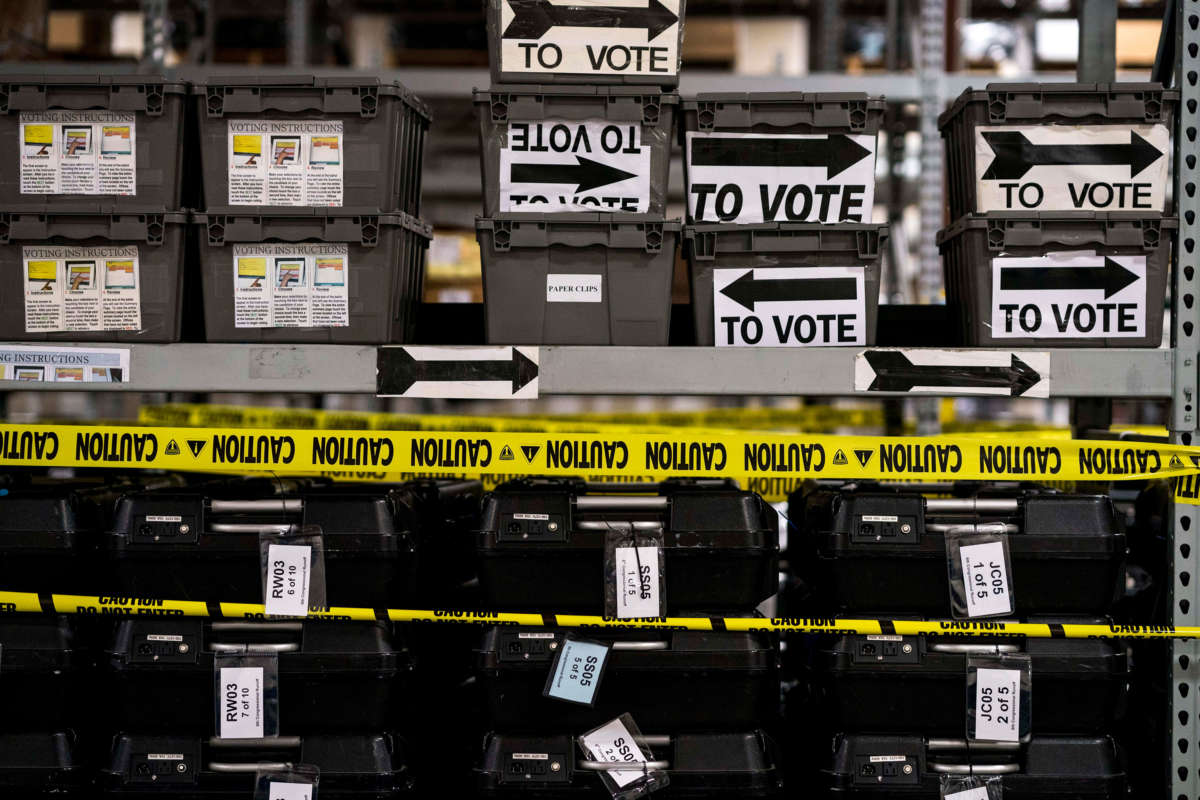 On the day after election day in Georgia, shelves and shelves of sequestered voting machines, wrapped with yellow caution tape, still sit unrecorded, and unused, at the Fulton County Election Preparation Center in Atlanta, Georgia, on November 6, 2018.