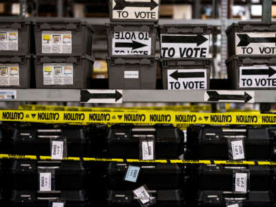 On the day after election day in Georgia, shelves and shelves of sequestered voting machines, wrapped with yellow caution tape, still sit unrecorded, and unused, at the Fulton County Election Preparation Center in Atlanta, Georgia, on November 6, 2018.