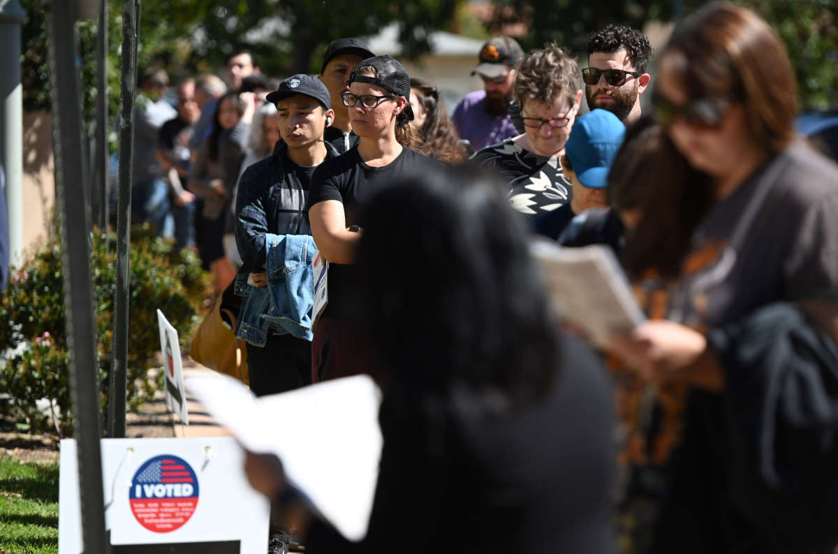 Voters wait in a long line to cast their ballot in the presidential primary at the Buena Vista Branch Library in Burbank, California, on Super Tuesday, March 3, 2020.