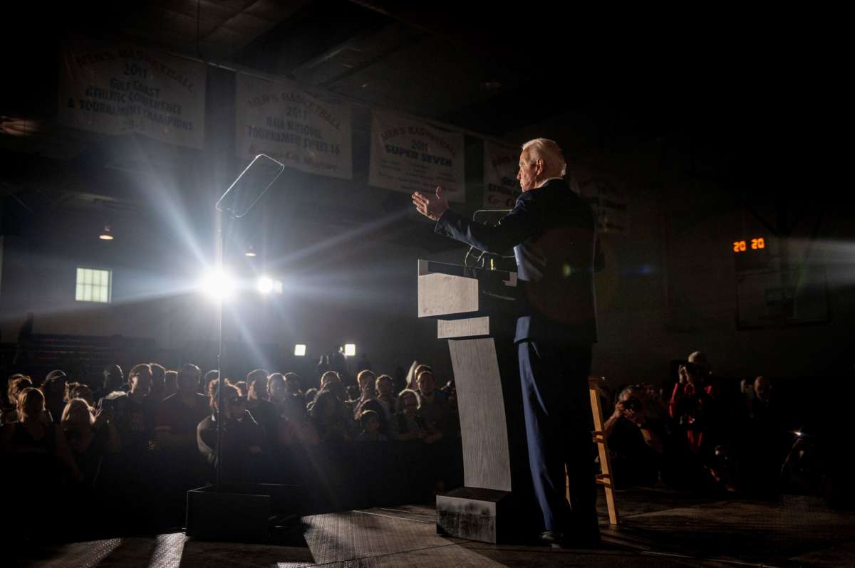 Joe Biden speaks on stage during a rally