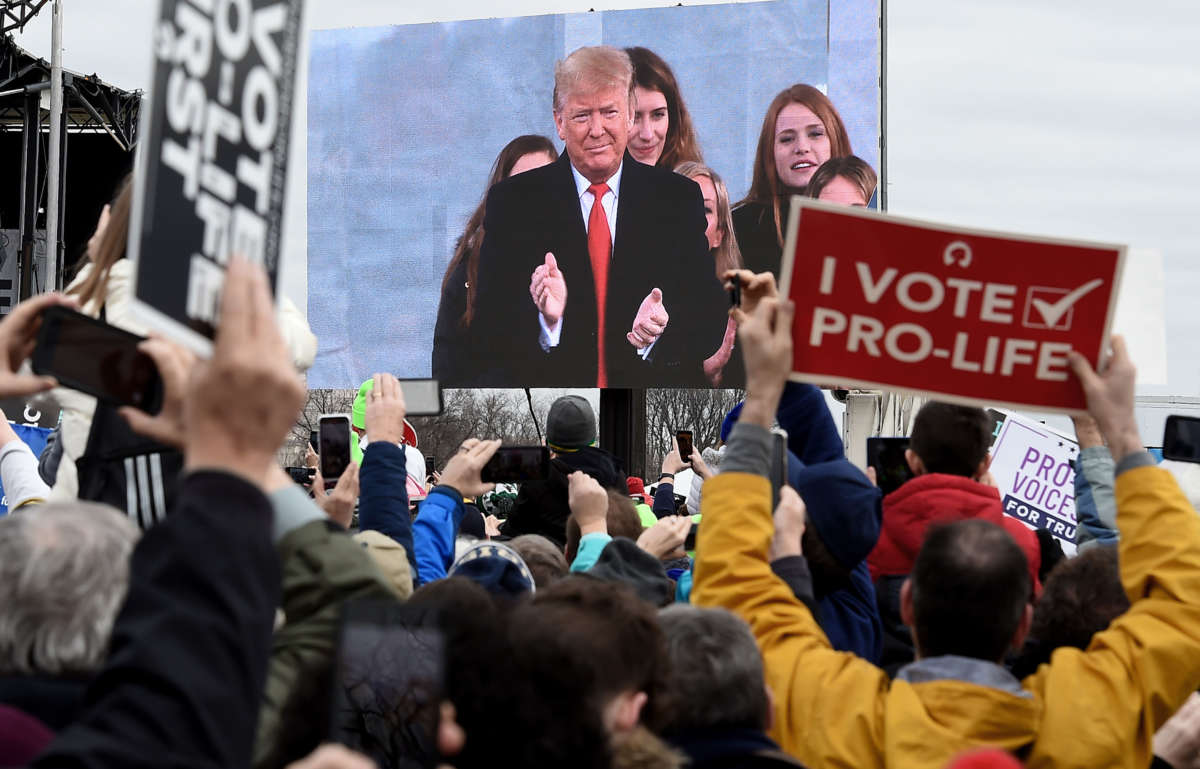 Anti-abortion demonstrators listen to President Trump as he speaks at the 47th annual "March for Life" in Washington, D.C., on January 24, 2020.