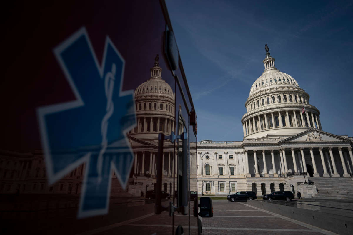 An ambulance sits parked on the plaza outside the U.S. Capitol, March 16, 2020, in Washington, D.C.