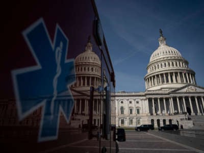 An ambulance sits parked on the plaza outside the U.S. Capitol, March 16, 2020, in Washington, D.C.