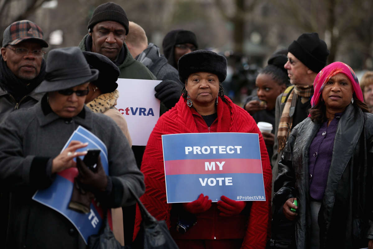 Residents from Alabama stand in line outside the U.S. Supreme Court for a chance to hear oral arguments in a legal challenge to Section 5 of the Voting Rights Act on February 27, 2013, in Washington, D.C.