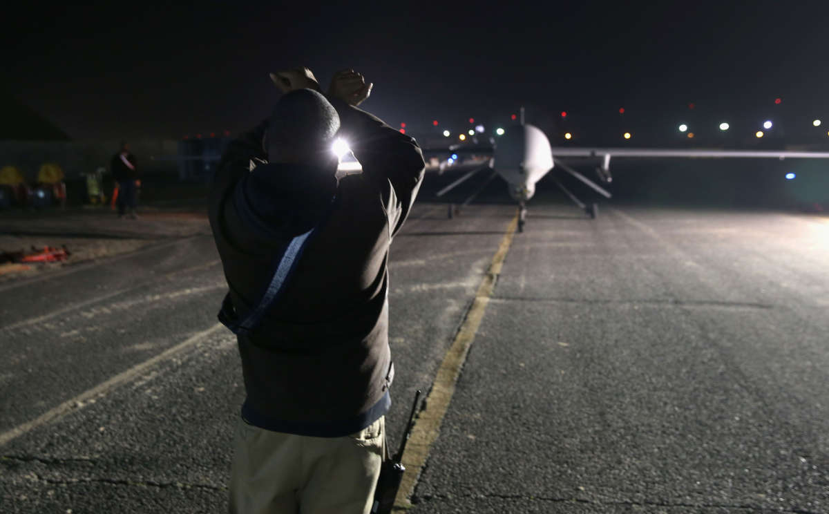 A ground crew guides a U.S. Air Force MQ-1B Predator unmanned aerial vehicle at an air base in the Persian Gulf region on January 7, 2016.