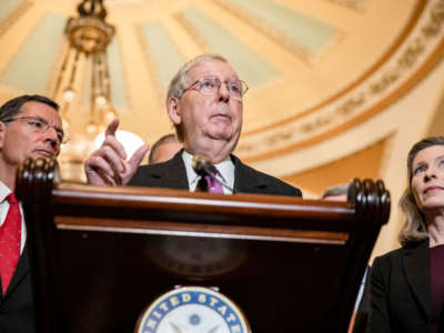 Senate Majority Leader Mitch McConnell speaks to reporters alongside Sens. John Barrasso and Joni Ernst, following the Senate Republican policy luncheon on March 10, 2020, in Washington, D.C.