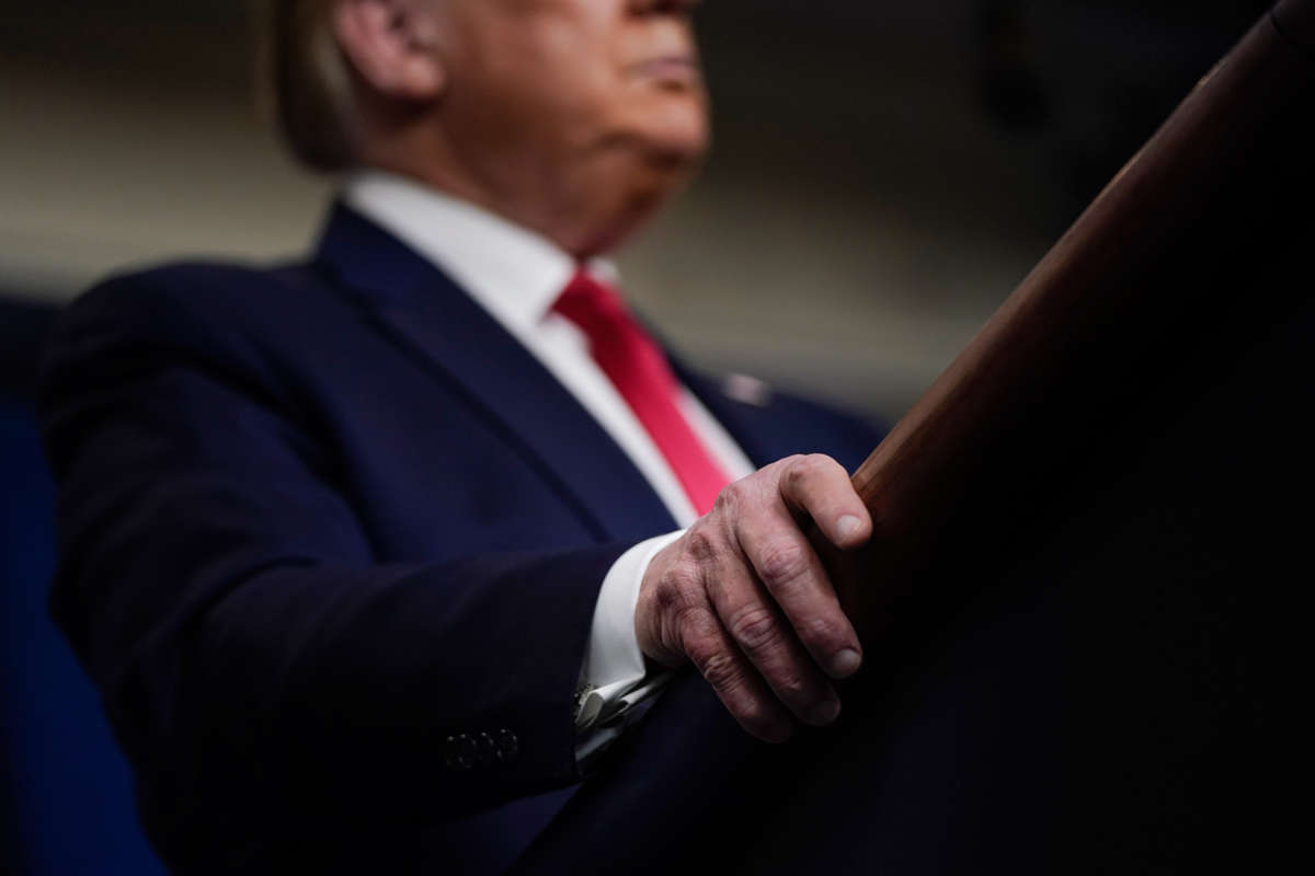 Donald Trump's hands on a podium