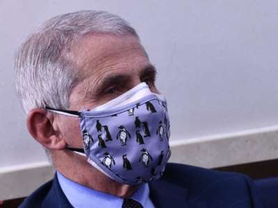 A close-up of Anthony Fauci, wearing two masks