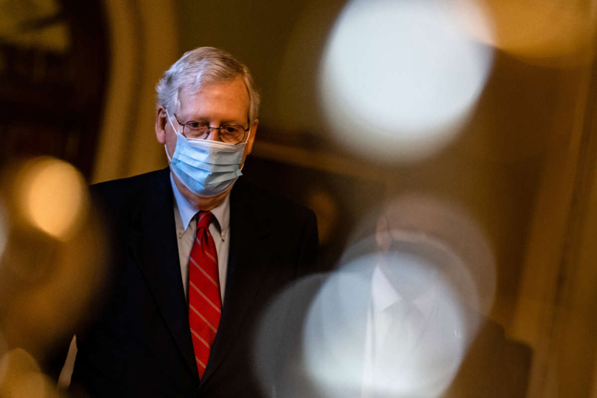 Senate Majority Leader Mitch McConnell heads to his office from the floor of the Senate on December 20, 2020, in Washington, D.C.