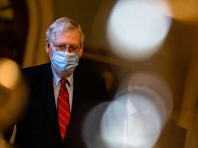 Senate Majority Leader Mitch McConnell heads to his office from the floor of the Senate on December 20, 2020, in Washington, D.C.