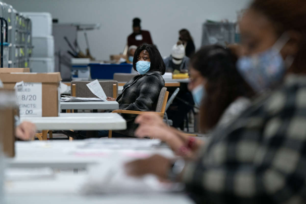 Election personnel sort ballots in preparation for an audit at the Gwinnett County Board of Voter Registrations and Elections offices on November 7, 2020, in Lawrenceville, Georgia.