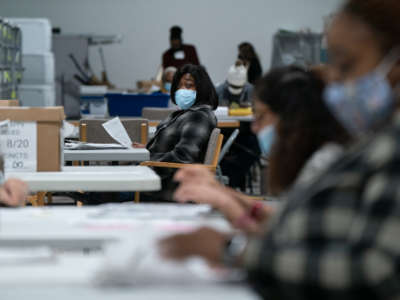 Election personnel sort ballots in preparation for an audit at the Gwinnett County Board of Voter Registrations and Elections offices on November 7, 2020, in Lawrenceville, Georgia.