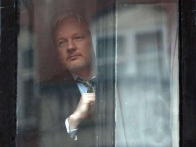 Wikileaks founder Julian Assange prepares to speak from the balcony of the Ecuadorian embassy on February 5, 2016, in London, England.