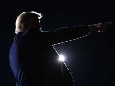 President Trump points after speaking during a rally in support of Republican incumbent senators Kelly Loeffler and David Perdue in Dalton, Georgia, on January 4, 2021.