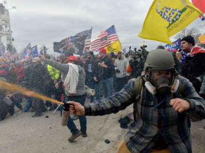 Trump loyalists clash with police and security forces as people try to storm the U.S. Capitol Building in Washington, D.C., on January 6, 2021.